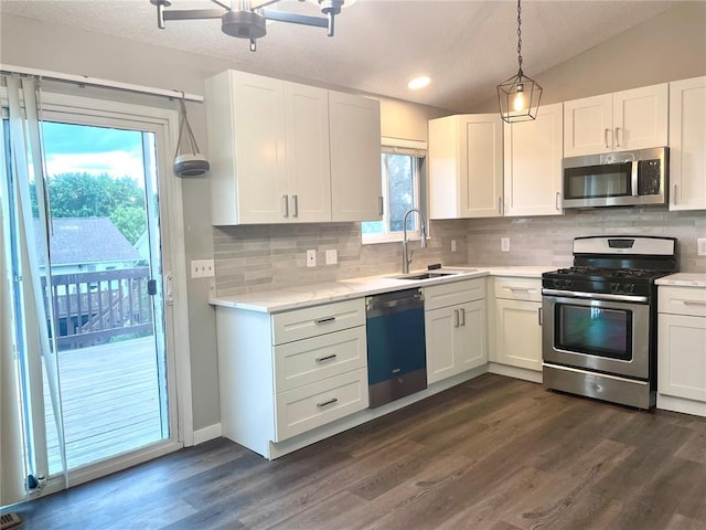 3060 Laurel Village Cir, Saint Peters, MO 63376 - kitchen featuring stainless steel appliances, a sink, backsplash, white cabinetry, and a textured ceiling
