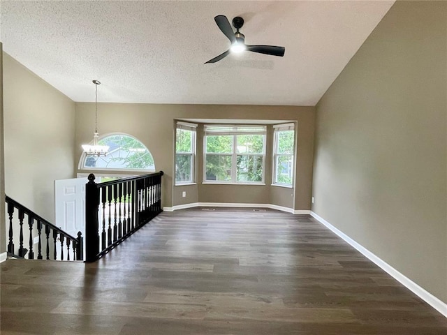 3060 Laurel Village Cir, Saint Peters, MO 63376 - unfurnished room featuring vaulted ceiling, wood finished floors, healthy amount of natural light, ceiling fan, and a chandelier