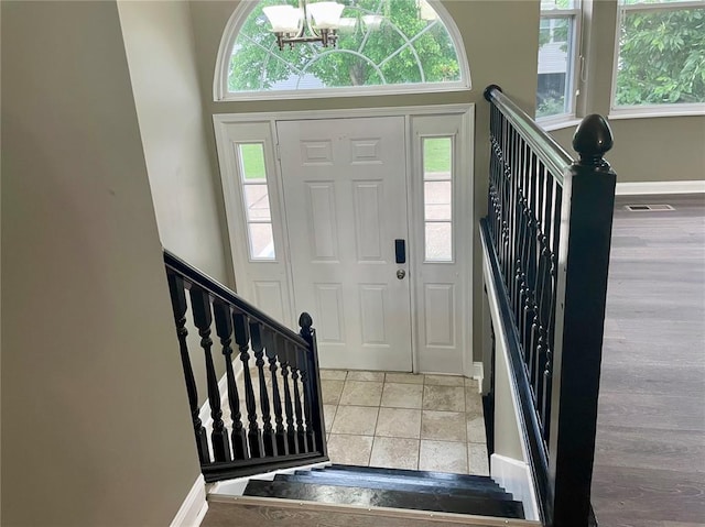 3060 Laurel Village Cir, Saint Peters, MO 63376 - foyer featuring a chandelier, baseboards, and stairs