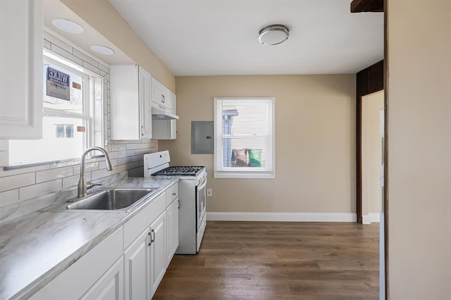 11893 Bridgevale Ave, Saint Louis, MO 63138 - kitchen with white range with gas cooktop, a sink, under cabinet range hood, and healthy amount of natural light