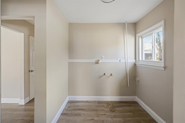11893 Bridgevale Ave, Saint Louis, MO 63138 - clothes washing area with wood finished floors and baseboards
