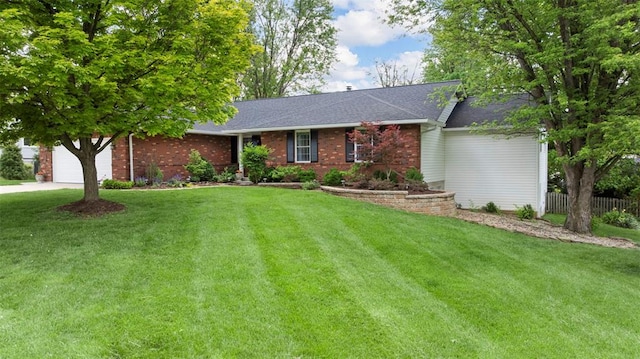 ranch-style home with an attached garage, driveway, brick siding, and roof with shingles