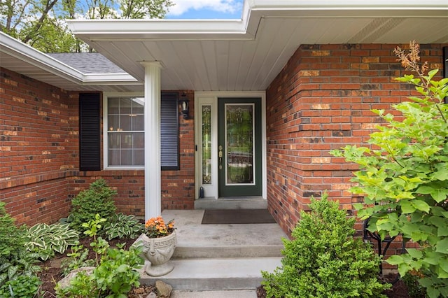 entrance to property with brick siding