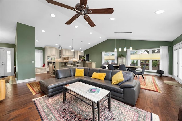 living area featuring lofted ceiling, ceiling fan, dark wood-type flooring, recessed lighting, and baseboards