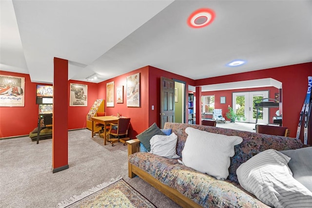 carpeted living room featuring french doors and baseboards