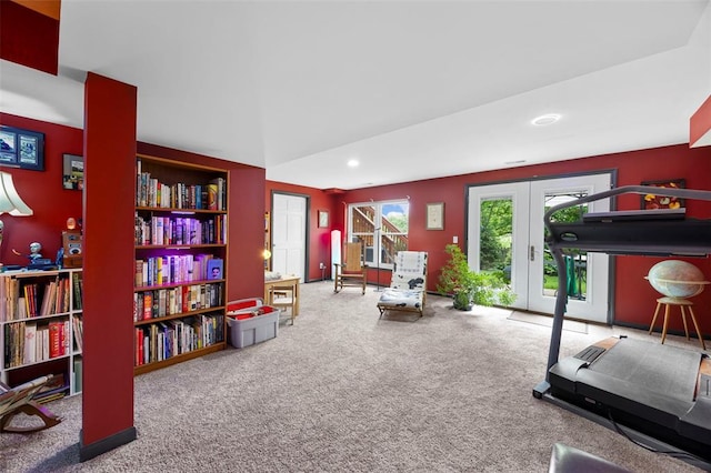 exercise area featuring french doors, carpet, and recessed lighting