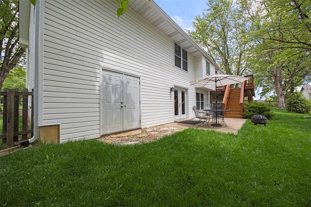 back of house featuring a patio area and a fire pit