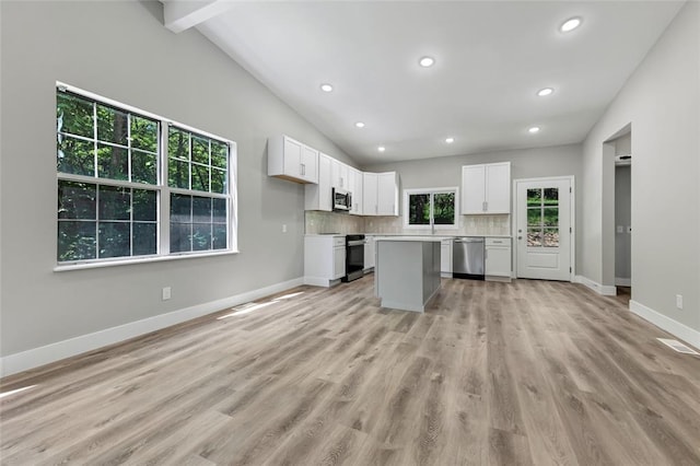 kitchen featuring stainless steel appliances, white cabinets, baseboards, recessed lighting, and light countertops