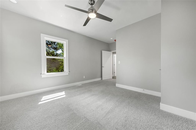 unfurnished bedroom with carpet floors, baseboards, and a ceiling fan