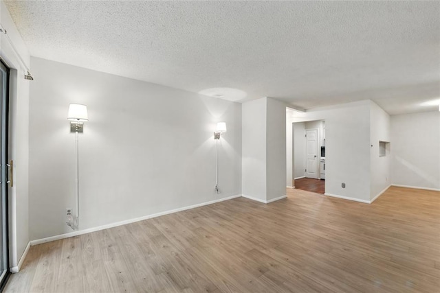 444 N Clay Ave Unit 2N, Kirkwood, MO 63122 - spare room with a textured ceiling, wood finished floors, and baseboards