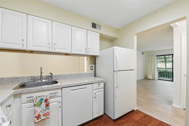 444 N Clay Ave Unit 2N, Kirkwood, MO 63122 - kitchen featuring white appliances, a sink, dark wood-type flooring, white cabinets, and light countertops