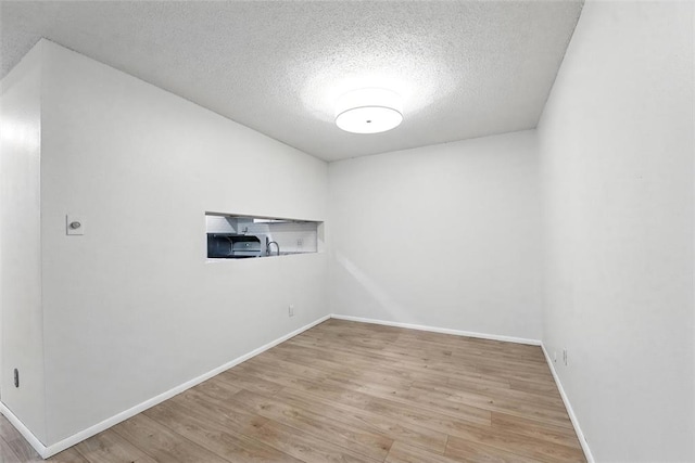 444 N Clay Ave Unit 2N, Kirkwood, MO 63122 - spare room with a textured ceiling, wood finished floors, and baseboards