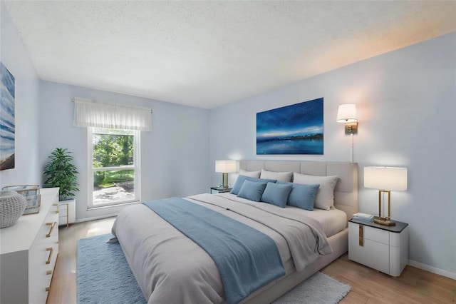 444 N Clay Ave Unit 2N, Kirkwood, MO 63122 - bedroom featuring light wood finished floors and baseboards