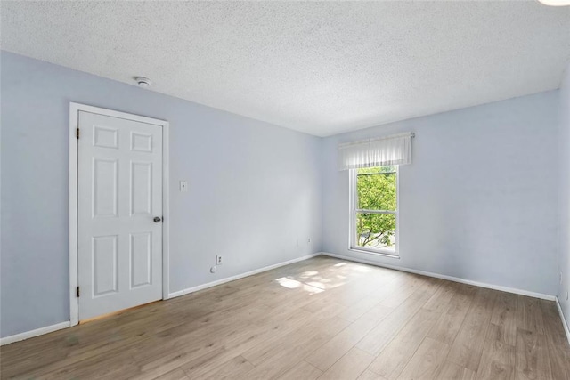 444 N Clay Ave Unit 2N, Kirkwood, MO 63122 - unfurnished room with a textured ceiling, wood finished floors, baseboards, and a smoke detector