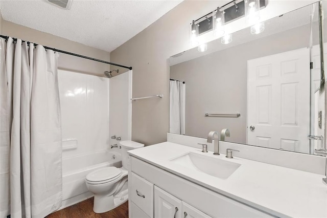 444 N Clay Ave Unit 2N, Kirkwood, MO 63122 - full bathroom featuring wood finished floors, toilet, a textured ceiling, vanity, and shower / bath combo