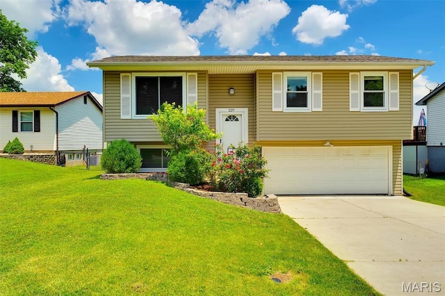 229 Stillbrook Estates Dr, Fenton, MO 63026 - bi-level home with concrete driveway, a garage, and a front yard