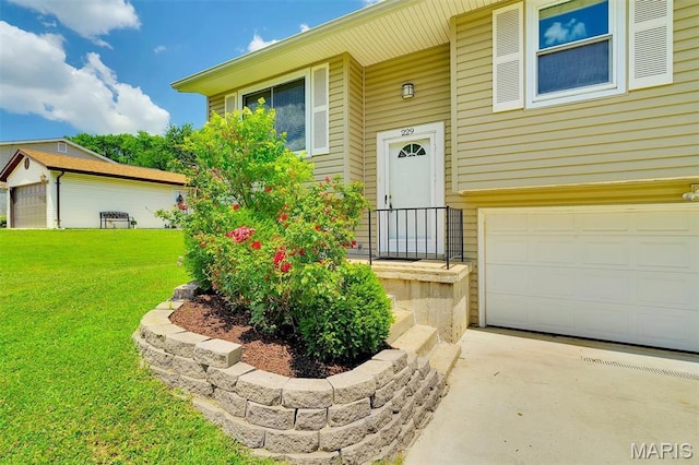 229 Stillbrook Estates Dr, Fenton, MO 63026 - view of exterior entry with an attached garage, a lawn, and driveway