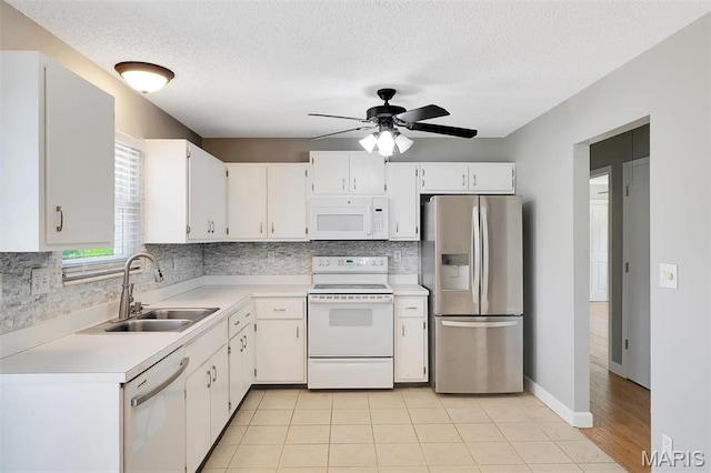 229 Stillbrook Estates Dr, Fenton, MO 63026 - kitchen featuring white appliances, light countertops, backsplash, white cabinetry, and a ceiling fan