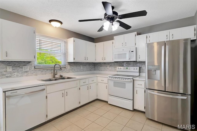 229 Stillbrook Estates Dr, Fenton, MO 63026 - kitchen featuring white appliances, light countertops, a textured ceiling, and backsplash
