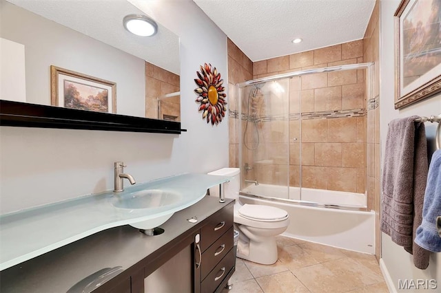 229 Stillbrook Estates Dr, Fenton, MO 63026 - bathroom featuring vanity, bath / shower combo with glass door, a textured ceiling, and tile patterned floors