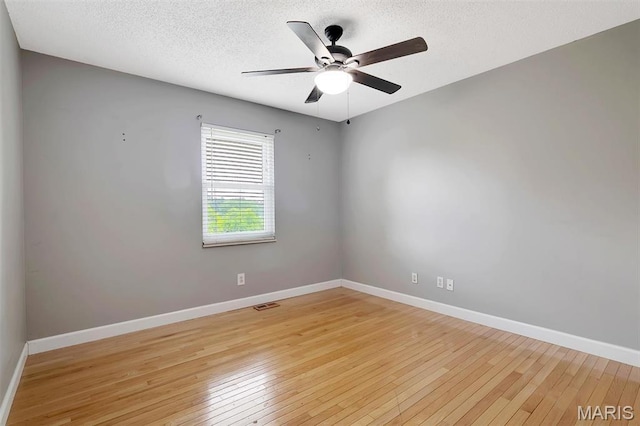 229 Stillbrook Estates Dr, Fenton, MO 63026 - spare room featuring a ceiling fan, light wood finished floors, and a textured ceiling