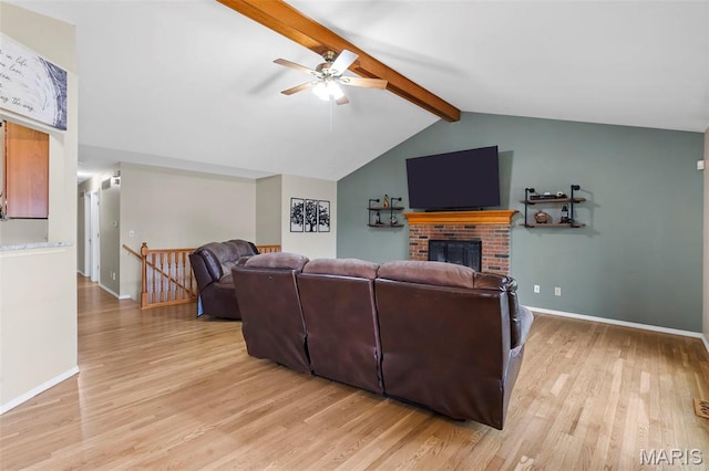 8 Baron Ridge Ct, Ofallon, MO 63366 - living area featuring light wood-style floors, a ceiling fan, and a fireplace