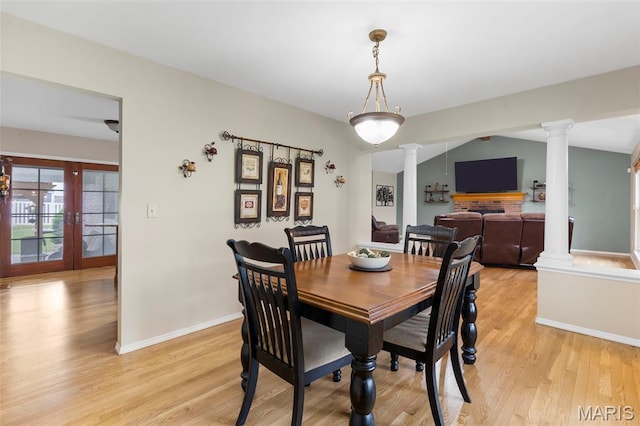8 Baron Ridge Ct, Ofallon, MO 63366 - dining room with ornate columns, light wood-type flooring, and french doors