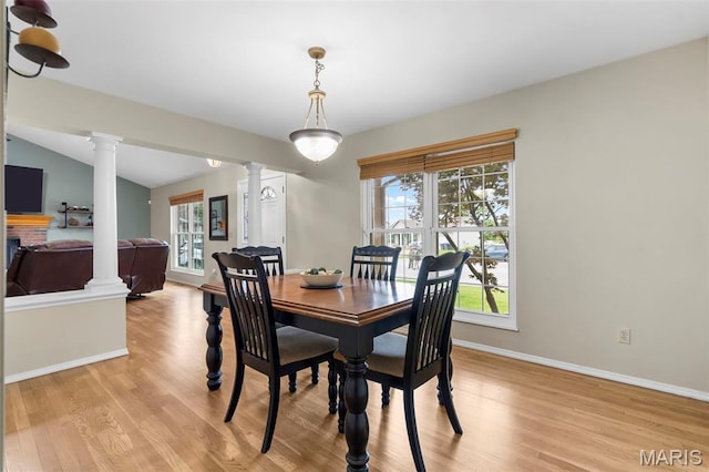 8 Baron Ridge Ct, Ofallon, MO 63366 - dining space with decorative columns and light wood finished floors