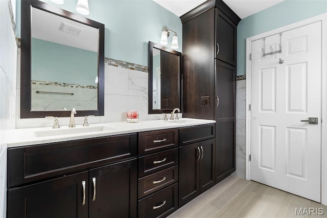 8 Baron Ridge Ct, Ofallon, MO 63366 - bathroom with tile walls and double vanity