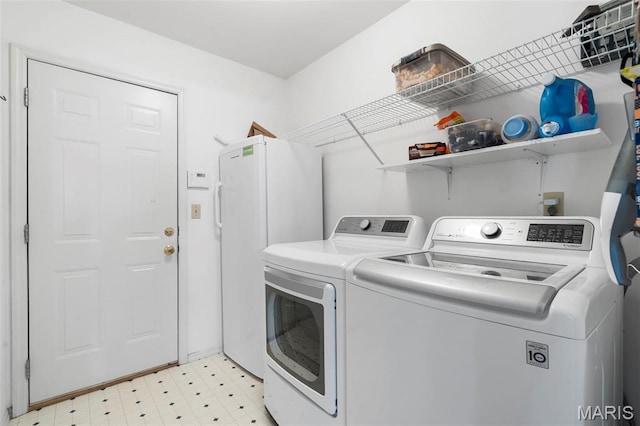 8 Baron Ridge Ct, Ofallon, MO 63366 - laundry room with washer and clothes dryer and light flooring