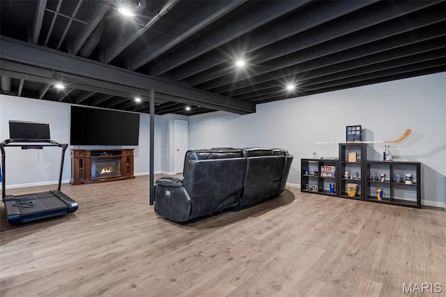 8 Baron Ridge Ct, Ofallon, MO 63366 - living room with wood finished floors and a warm lit fireplace
