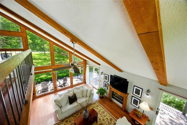 living room featuring wood finished floors and a ceiling fan