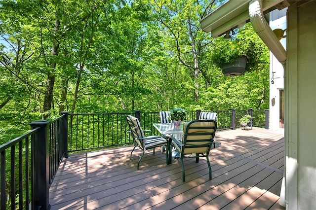 deck with outdoor dining area
