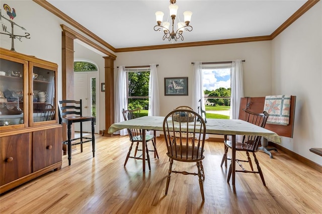 214 Townview Ct, Wentzville, MO 63385 - dining area with light wood-style floors, crown molding, a chandelier, and baseboards