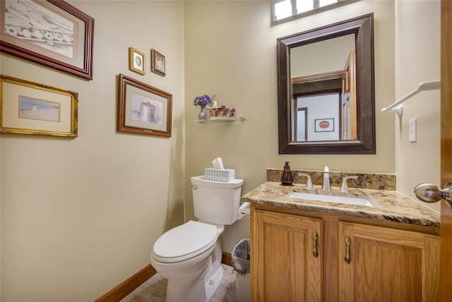 214 Townview Ct, Wentzville, MO 63385 - bathroom with toilet, vanity, and baseboards