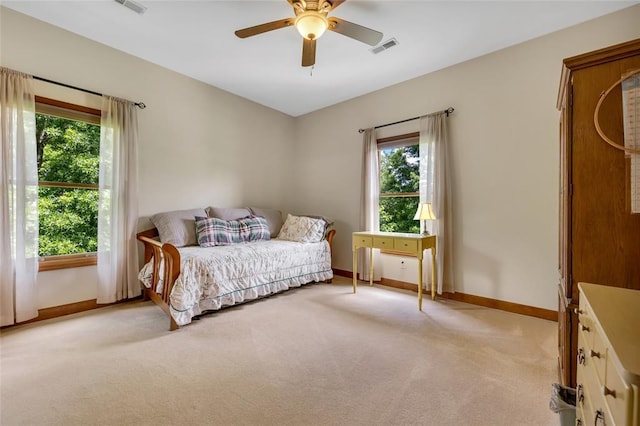 214 Townview Ct, Wentzville, MO 63385 - bedroom featuring multiple windows, baseboards, and light carpet