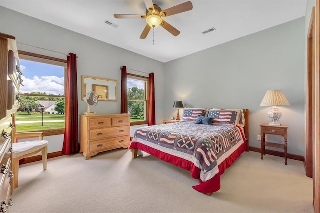 214 Townview Ct, Wentzville, MO 63385 - bedroom with light carpet, baseboards, and a ceiling fan