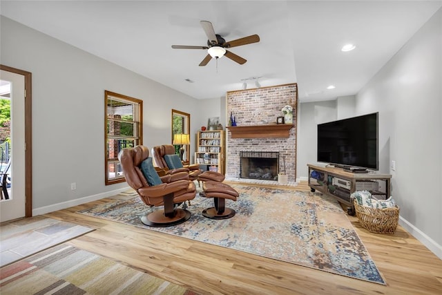 214 Townview Ct, Wentzville, MO 63385 - living room with healthy amount of natural light, wood finished floors, baseboards, ceiling fan, and recessed lighting