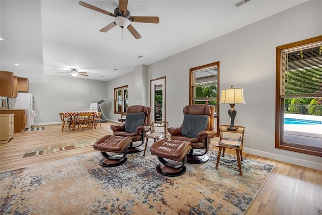 214 Townview Ct, Wentzville, MO 63385 - living area with a ceiling fan, healthy amount of natural light, light wood-style flooring, baseboards, and recessed lighting