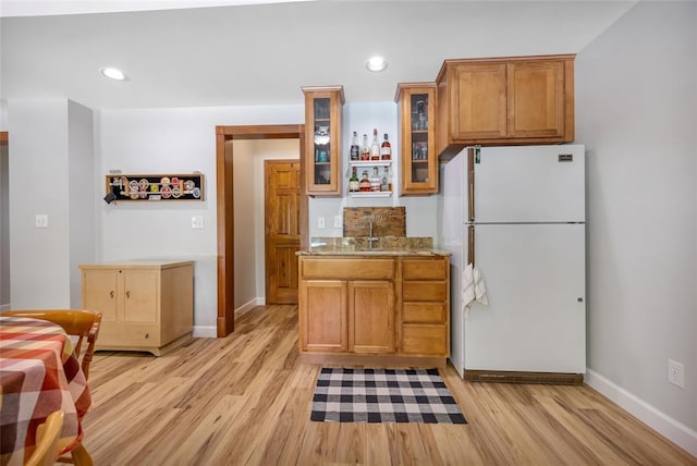 214 Townview Ct, Wentzville, MO 63385 - kitchen featuring freestanding refrigerator, light wood-style floors, baseboards, and recessed lighting