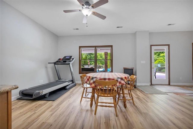 214 Townview Ct, Wentzville, MO 63385 - dining space with plenty of natural light, light wood-style floors, and baseboards