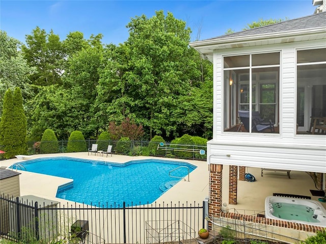 214 Townview Ct, Wentzville, MO 63385 - view of swimming pool with a patio, an outdoor hot tub, and view of wooded area