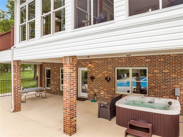 214 Townview Ct, Wentzville, MO 63385 - view of patio featuring a hot tub