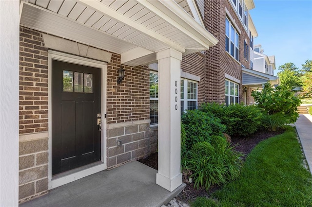8000 Central Park Dr, Richmond Heights, MO 63117 - doorway to property featuring brick siding