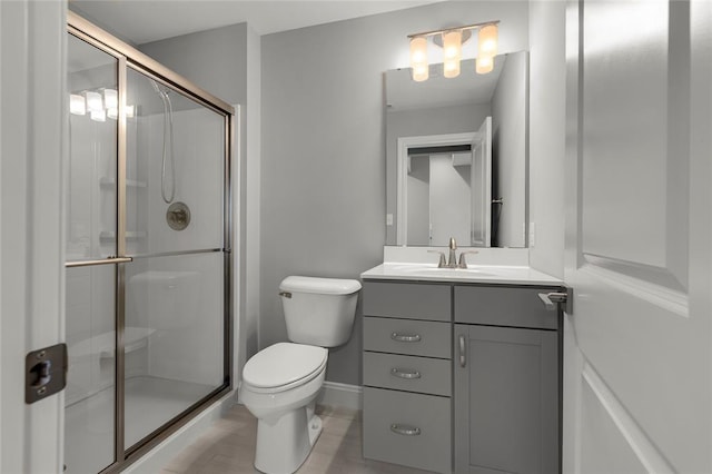 8000 Central Park Dr, Richmond Heights, MO 63117 - full bath with vanity, toilet, a shower stall, and baseboards
