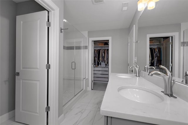 8000 Central Park Dr, Richmond Heights, MO 63117 - bathroom featuring marble finish flooring, a walk in closet, a shower stall, and double vanity