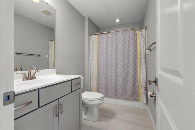 8000 Central Park Dr, Richmond Heights, MO 63117 - full bath featuring vanity, toilet, and shower / bath combo with shower curtain