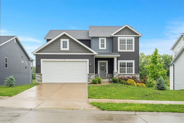 207 Still Creek Dr, Lake St Louis, MO 63367 - craftsman inspired home with stone siding, concrete driveway, a front lawn, a garage, and roof with shingles