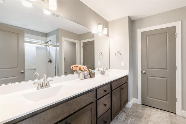 207 Still Creek Dr, Lake St Louis, MO 63367 - bathroom with baseboards, double vanity, and a shower with door