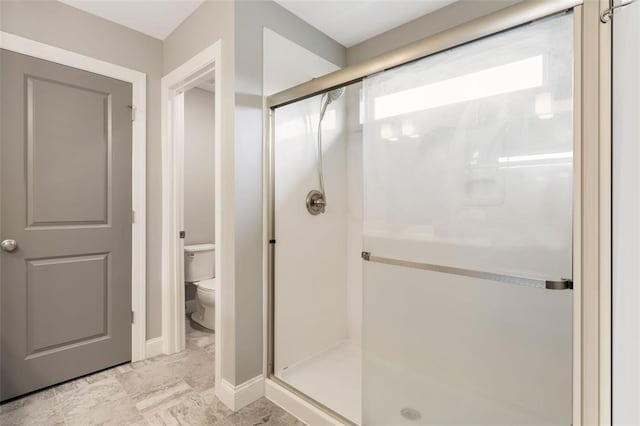 207 Still Creek Dr, Lake St Louis, MO 63367 - full bathroom with a stall shower, toilet, marble finish floors, and baseboards
